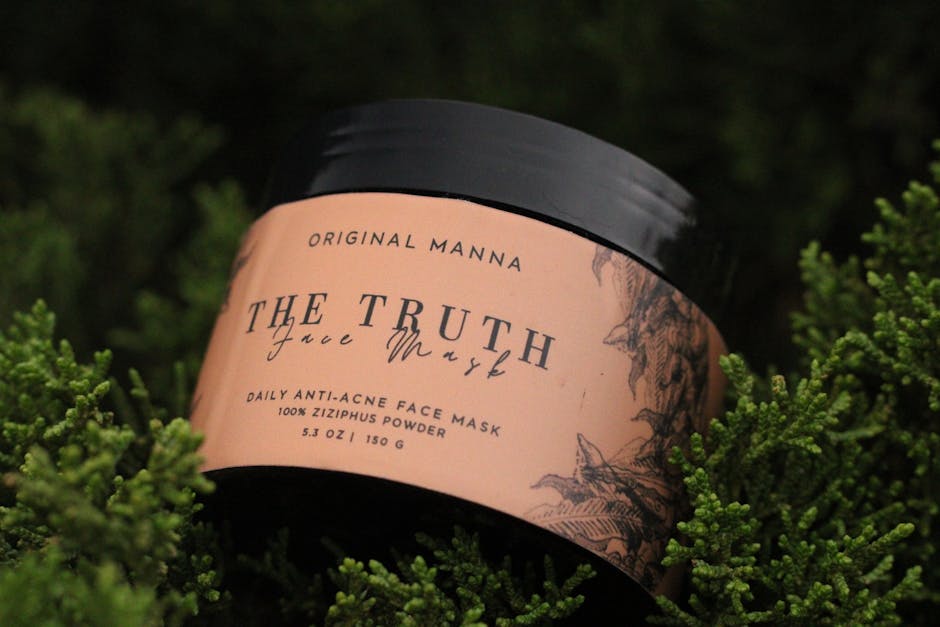 Face mask container amidst lush green foliage, emphasizing natural skincare